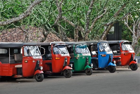 Bright coloured tuk-tuks on Srilankan roads