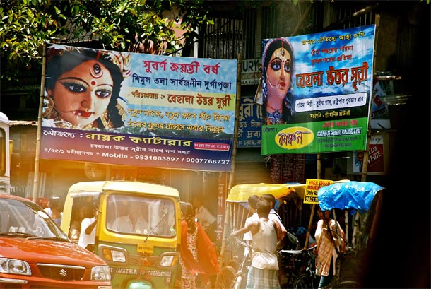 An auto squeezes itself through traffic