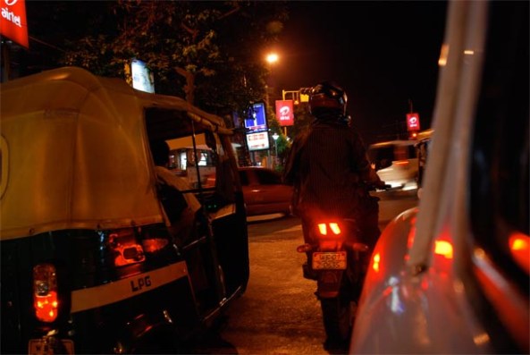 An Auto speeding through night-traffic