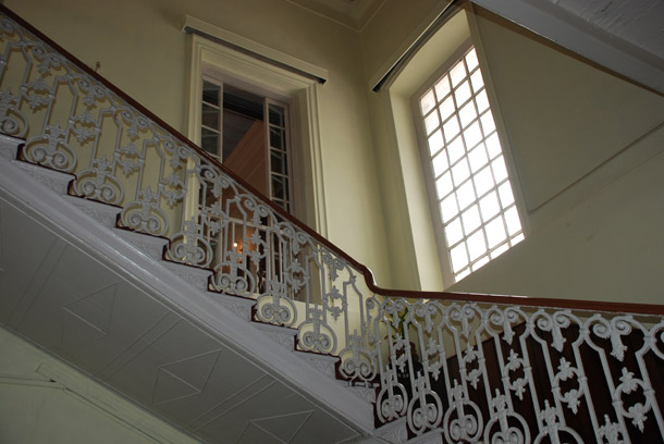 The grand wooden staircase leading to the Magistrate's private residential area