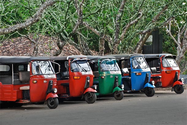 Bright coloured tuk-tuks on Srilankan roads