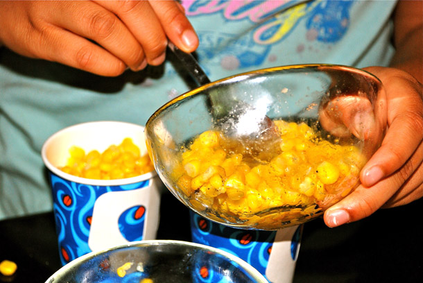 Pouring them into paper cups Pouring them into paper cups