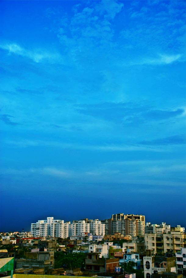 The mighty high-rises against a mightier sky