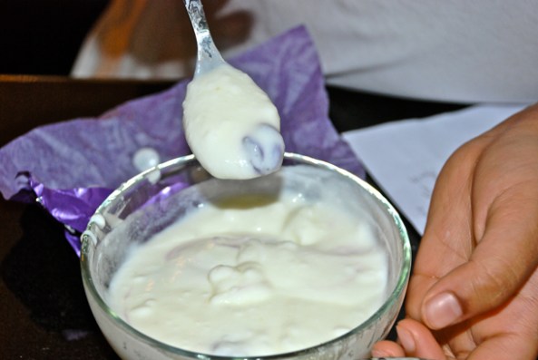 Mixing the molten M&Ms with yoghurt Mixing the molten M&Ms with yoghurt