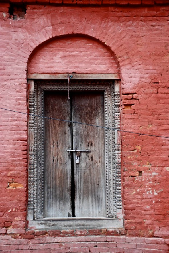 Red bricks, intricate wooden carvings of the Mahasthan Ghar