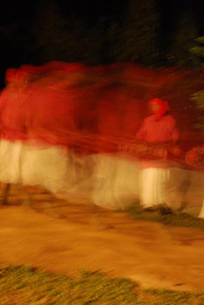 Thiru dancers, blurred by their motion