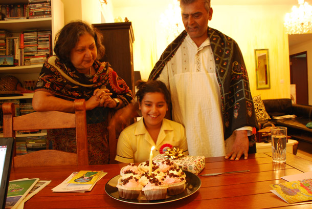 Big Z turns 8! Cutting a cake before going to school - my parents look on