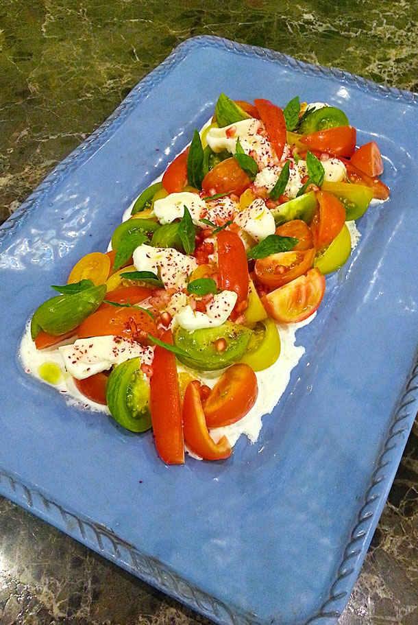 Heritage Tomatoes, Emirati Burrata with Pomegranate & Sumac dressing; Omnia Gourmet by Sylvena Heritage Tomatoes, Emirati Burrata with Pomegranate & Sumac dressing