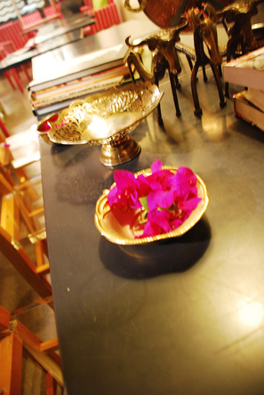 Table decoration with personal silver bowls, folk artefacts from Bengal