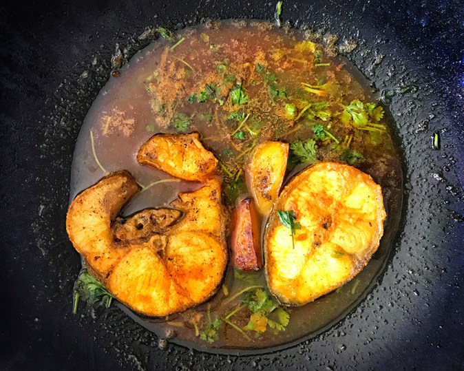 Aar match prepared in a light gravy with turmeric and cumin