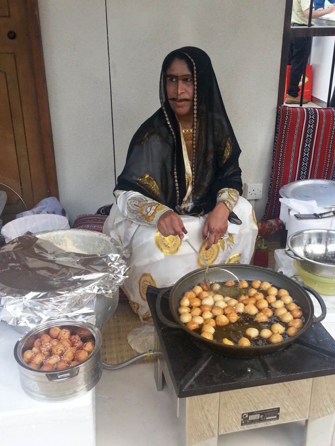 Leqaimat, crispy fried golden dough balls coated with date syrup and sesame seeds. This is one deadly-divine-dessert!