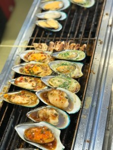 Grilled mussels in Floating Market in Global Village