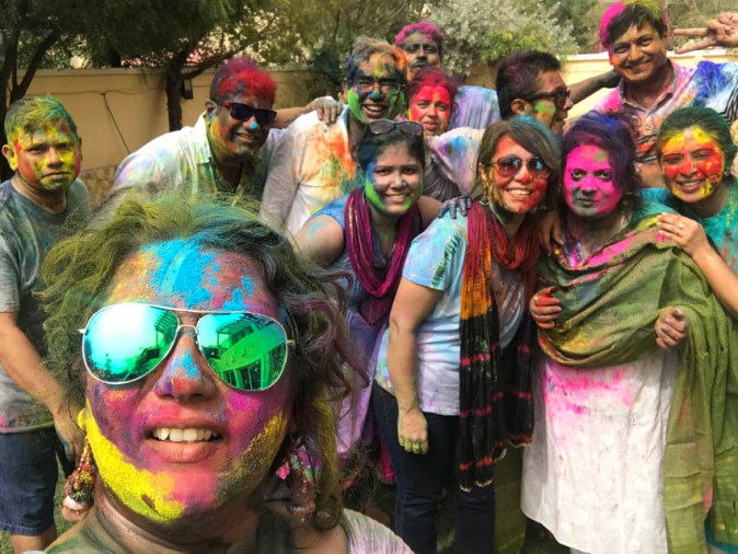 People with Holi colours on their faces